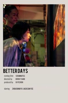 a man and woman standing next to each other in front of a tv screen with the words betterdays written on it