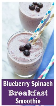 blueberry spinach breakfast smoothie in two glasses with straws on the side