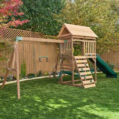 a wooden swing set and slide in the backyard