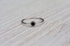 Gorgeous, simple, filigree ring with black gemstone- black onyx handcrafted in 14k white gold. The onyx is a natural gemstone, Earth mined. In the back of the ring secret heart. Makes it perfect gift to celebrate Valentine's day, anniversary, birthday or any other occasion. This ring is made to order in YOUR SIZE. CENTER STONE: *100% natural, AAA quality onyx *round cabochon *color: black *diameter: 3mm APPROXIMATE MEASUREMENTS OF THE RING: *onyx with setting: 4.5mm *band: approximately 1mm *mat White Gold Onyx Rings For Gift, Minimalist Onyx Jewelry For Anniversary, Minimalist Black Sterling Silver Ring, Black Everyday Ring Jewelry, Everyday Black Ring Jewelry, Black Everyday Ring, Minimalist Silver Rings With Black Enamel, Silver Minimalist Rings With Black Enamel, Elegant Onyx Rings For Everyday Wear