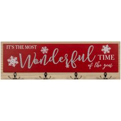 a wooden sign that says it's the most wonderful time of the year with snowflakes