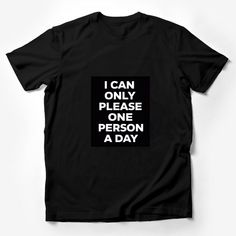 Make a statement with this bold and humorous graphic t-shirt! Perfect for those days when you want to remind everyone that you can only please one person a day. This tee is made with high-quality material for comfort and durability. The black background highlights the white text that playfully says, I CAN ONLY PLEASE ONE PERSON A DAY. It's a unisex fit, ideal for anyone looking to add a touch of sarcasm to their wardrobe or searching for a fun gift for a friend with a sense of humor. Easy to wea Funny Adult Shirts, Be Bold Quotes, Text Tee, Statement Tshirt, Funny Graphic Tees, Casual Summer Shirts, Funny Graphics, Friends Shirt, Gift For Friend