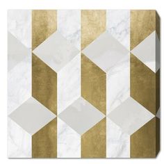 a white and gold geometric tile design