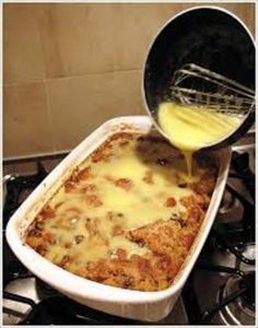 a pan filled with food sitting on top of a stove next to a burner