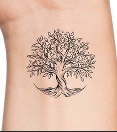 a small tree tattoo on the side of a woman's neck, with leaves growing out of it