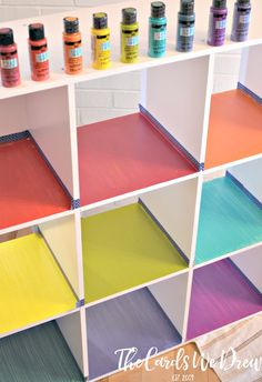 the shelves have different colors of paint on them