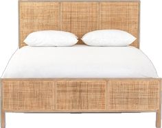 an image of a bed with white pillows and wicker headboard on the side