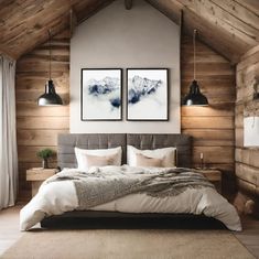 a bedroom with wood walls and two pictures on the wall above the bed in front of it