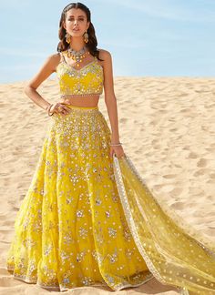 Bloom like a sunflower in our Yellow Mirror Embroidered Organza Lehenga! Adorned with sequin & mirror hand work embellishments around the hem and the neckline. Bollywood Embroidered Lehenga For Summer, Summer Bollywood Style Embroidered Lehenga, Summer Bollywood Embroidered Lehenga, Summer Festive Organza Lehenga, Yellow Embellished Summer Sets, Summer Anarkali Embellished Lehenga, Summer Anarkali Style Embellished Lehenga, Summer Embellished Anarkali Lehenga, Summer Anarkali Organza Lehenga