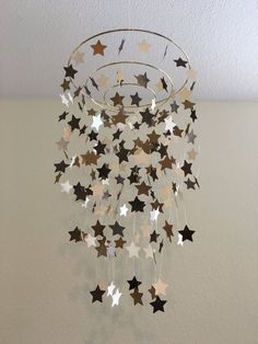 a chandelier with stars hanging from the ceiling