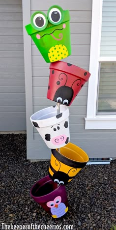 some paper cups are stacked on top of each other in the shape of a flower pot