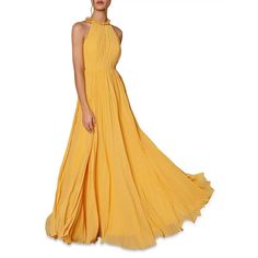 a woman in a long yellow dress