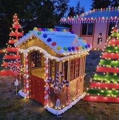 a house is decorated with christmas lights and candy canes for the holiday decorations on display