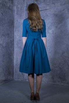 Blue green shade dress with pleated skirts. Dress with mid sleeves and zipper on the side, tying belt at the back. ➤ Features > dress length: 103 cm / 40,5'' - 107 cm / 42,1'' > mid sleeves > rounded neckline > pleats at skirt part > tying waistband at the back ➤ Sizing My Size Guide in FAQ section below will help you define the perfect size match. The item can also be made according to your measurements - just message them to me. ➤ Delivery Your item is made-to-order and will be 1950s Style A-line Pleated Dress, 1950s Style A-line Dress With Box Pleat, 1950s-inspired A-line Pleated Dress, Blue A-line Dresses With Box Pleat, Knee-length Cotton Dresses With Pleated Skirt, Cotton Dress With Pleated Full Skirt, Blue Knee-length Dress With Pleated Skirt, Green Retro Dress With Full Skirt, Green Retro Full Skirt Dress