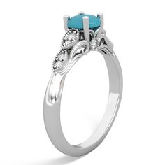 Feauturing flowing filigree scrolls and delicate milgrain accents, this turquoise turquoise ring in 14K White Gold is truly unique. Ten sparkling diamonds are nestled among the intricate details of this one-of-a-kind piece. Elegant Turquoise Diamond Ring, Elegant Diamond Turquoise Ring For Anniversary, Elegant Turquoise Diamond Ring For Anniversary, Elegant Turquoise Diamond Ring With Center Stone, Elegant Turquoise Ring With Diamond Accents, Elegant Turquoise Ring With Diamond Accents As Gift, Elegant Turquoise Ring With Center Stone, Elegant Turquoise Ring, Elegant Turquoise Ring With Accent Stones