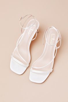 Keep things chic and simple by adding the Lulus Kierha White Satin Strappy Low Heel Sandals to any of your effortlessly elegant 'fits! Sleek woven satin shapes these darling heels that feature a square footbed and a trio of slender straps that cross the vamp. A matching strap wraps the front of the ankle and secures with a gold buckle, all atop a trendy blade heel. 2. 75" wrapped blade heel. Cushioned insole. Felted rubber sole has nonskid markings. Man made materials. Imported. Lulus | Kierha W Straps Sandals, Flat Homecoming Shoes, White Heel Shoes, White Sandals With Heel Strap And Low Heel, White Low Heel Sandals With Wrapped Heel, Satin Low Heels With Wrapped Heel, Low Heel Satin Heels For Prom, Cute Low Heel White Heels, Dainty Heels