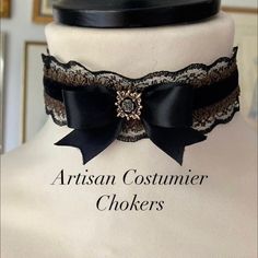 Beautiful 18th Century style lace choker made with black double faced black satin ribbon, the neckband has a black velvet ribbon running through the centre which is a gorgeous detail, trimmed with a vintage style black lace and antique gold lace which gives a layered effect, hand tied black ribbon bow with a gem stone. The elegant choker is made with a half inch wide black double faced black satin ribbon, running through the centre is a gorgeous black velvet ribbon at the centre is a hand tied b Elegant Adjustable Jewelry For Costume Party, Elegant Black Formal Choker, Elegant Black Choker For Wedding, Elegant Black Wedding Choker, Elegant Costume Jewelry Choker, Elegant Black Lace Choker, Adjustable Black Choker For Costume Party, Adjustable Black Ribbon Party Choker, Victorian Adjustable Choker For Formal Occasions