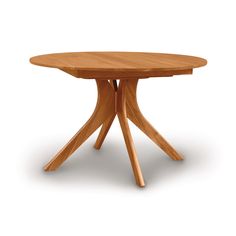 a round wooden table with four legs on an isolated white background for use in interior design