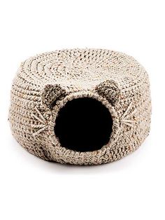 the cat bed is knitted and has a hole in it