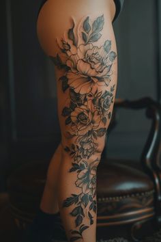 a woman's leg with flowers on it