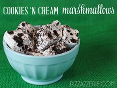 cookies'n cream marshmallows in a blue bowl on a green background