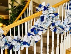 blue and white ribbon garland on the banister