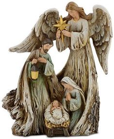 a nativity figurine with an angel holding a star