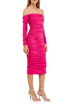 Add a pop of electric pink to your night out in this ruched-to-fit dress designed to show off your shoulders. Off-the-shoulder neck Long sleeves 65% polyester, 30% rayon, 5% spandex Hand wash, dry flat Imported Pink Evening Dress With Ruched Sides, Pink Party Dress With Ruched Sides, Pink One Shoulder Ruched Midi Dress, Pink One-shoulder Ruched Midi Dress, Pink Off-shoulder Midi Dress For Night Out, Pink Ruched Midi Dress For Night Out, Pink Ruched Dress For Dinner, Pink Draped Midi Dress For Night Out, Pink Ruched Midi Dress For Date Night