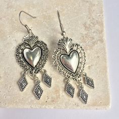 These Silver Sacred Heart Earrings Make A Statement. The Dark Patina In The Small Details Of The Charms Adds To The Lovely Handmade Feel. Silver Plated Ear Wires & Charms. Approx. Size: 2.5"L, 7/8"W New, Handmade By: Jpeace Designs *See My Other Listings In This Sacred Heart Collection* Religious, Rockabilly, Dia De Los Muertos, Day Of The Dead, Punk, Rock N Roll, Edgy Jewelry, Lady Biker, Skull, Virgin De Guadalupe, Mexico, Western, Sundance, Artsy, Vintage Antique Style Nickel-free Dangle Heart Earrings For Festivals, Silver Bohemian Heart Earrings For Valentine's Day, Nickel Free Heart Earrings For Festivals, Nickel-free Heart Earrings For Festivals, Dream Accessories, Edgy Jewelry, Diamond Dangle Earrings, Lady Biker, Small Details