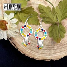 Beautiful Handmade Mexican Earrings , Mexican Shakira Earrings , Bohemian Boho earrings. 100% Handmade Handcraft by great Artisans in Mexico , These lovely Ear Wire earrings are extremely light and can be worn on all everyday occasions specially if you like colorful and fresh accessories. Aprox Size : 3 1/4 inches length & 1 3/8 inch wide Every piece is unique and color might change a little , depending on the screen device its been viewed on Aretes Mexicanos de Shakira , hecho a mano , Arte for Multicolor Beaded Flower Earrings For Festivals, Bohemian Multicolor Hoop Earrings With Dangling Beads, Bohemian Rainbow Beaded Round Earrings, Colorful Bohemian Hoop Earrings For Festival, Bohemian Rainbow Round Beaded Earrings, Colorful Bohemian Round Beaded Earrings, White Bohemian Dangle Hoop Earrings, Bohemian Rainbow Earrings With Dangling Beads, Bohemian Multicolor Beaded Round Earrings