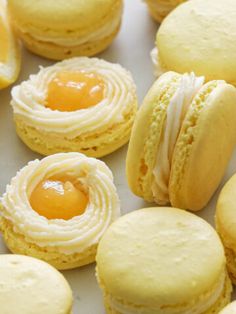 some very pretty looking pastries with icing on them and eggs in the middle