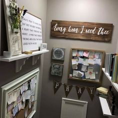 a room that has some pictures on the wall and other items hanging from the shelves