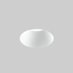 an empty white bowl on a gray background