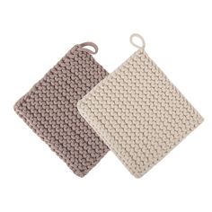 two knitted dishcloths on white and grey background, one has a hook in the middle