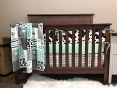 a baby crib with a white sheep rug on the floor