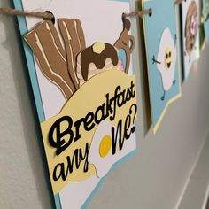 there are posters hanging on the wall with words breakfast is my me? and an egg