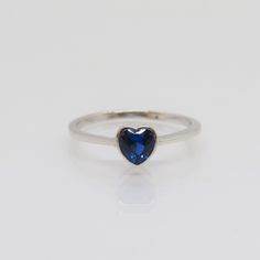 Sterling Silver Blue Sapphire Heart Ring....Marked 925...Total of weights 1.2grams... Size 7...Measure of Face 6MM...It's in very good condition. Blue Birthstone Heart Ring As Gift, Blue Birthstone Heart Ring For Gift, Blue Sterling Silver Heart Ring For Anniversary, Blue Sterling Silver Heart Ring Gift, Blue Heart Sterling Silver Ring For Gift, Blue Round Heart Ring As Gift, Blue Heart Cut Promise Ring, Blue Sterling Silver Heart Ring, Blue Sterling Silver Heart Cut Ring