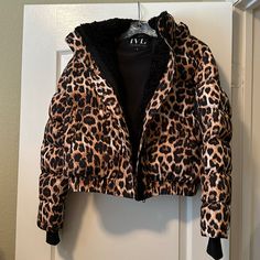 This Jacket Is High Quality And So Warm! Removable Hoodie. Faux Fur Lined Around Front Zipper. Side Pockets Plus Zippered Arm Pocket For Essentials. Thumb Holes. Measures 22 Inches Long And 23 Inches Across From Armpit To Armpit When Flat And Zipped. Only Worn Once, Like New! Leopard Puffer Jacket, Fitted Faux Fur Outerwear In Leopard Print, Vintage Leopard Print Winter Outerwear, Winter Leopard Print Faux Fur Outerwear, Luxury Long Sleeve Leopard Print Outerwear, Thumb Holes, Black Tan, Puffer Jacket, Black And Tan