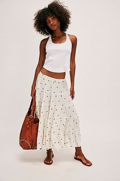 Our beloved In Full Swing midi skirt — now with a sweet embroidered finish! **Fit:** Low-slung, billowy silhouette **Features:** Textured embroidered detailing, lightweight design, stretchy elastic waistband, tiered seaming, A-line hem **Why We ❤ It:** This timeless skirt can be dressed up with your favorite femme corset or dressed down with a playful baby tee. | In Full Swing Embroidered Midi Skirt by Free People in White, Size: XL White Embroidered Maxi Skirt For Spring, Embroidered Flared Skirt For Summer, Casual Summer Skirt With Embroidered Hem, Casual Embroidered Tiered Skirt Bottoms, Casual Embroidered Tiered Skirt, Embroidered Tiered Skirt For Summer, Summer Floral Embroidery Tiered Skirt, Summer Embroidered Flowy Maxi Skirt, Embroidered Flowy Maxi Skirt For Summer