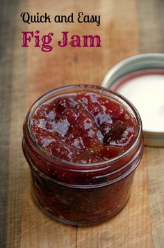 a jar filled with jam sitting on top of a wooden table