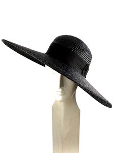 Elegant woman summer hat made with black natural straw braid of 8/9 millimeters wide. Adorned with a good quality 50mm wide black grosgrain ribbon with a bow onside the hat. The measurements in centimeters are 50 x 48. Brim length 15. (These measurements may vary slightly depending on the size of the hat) For its elaboration we only use very good quality and resistant straw braids. In our workshop in the Pyrenees we sew and work one by one our hats with wooden molds of our own design. For other Black Summer Hats With Curved Brim, Black Summer Hat With Curved Brim, Black Adjustable Hat For Summer, Adjustable Black Hat For Summer, Adjustable Black Summer Hat, Black Adjustable Summer Hat, Summer Panama Hat With Uv Protection For Pool, Black Brimmed Summer Hat, Black Wide Brim Straw Hat With Upf 50+