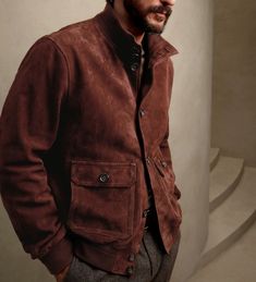 Classic meets contemporary: Make a statement in this stylish brown suede bomber jacket. #brownjacket #suedejacket Fall Varsity Jacket With Stand Collar And Pockets, Brown Varsity Jacket With Pockets For Fall, Casual Brown Outerwear With Ribbed Collar, Winter Collared Varsity Jacket With Pockets, Fall Collared Varsity Jacket With Pockets, Brown Leather Jacket With Ribbed Cuffs, Classic Brown Varsity Jacket For Fall, Classic Brown Winter Varsity Jacket, Classic Brown Long Sleeve Varsity Jacket