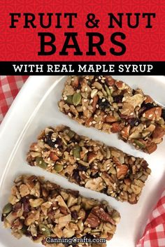 fruit and nut bars with real maple syrup on a white plate next to a red checkered tablecloth