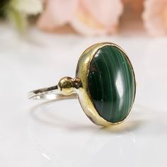 Green Malachite Ring, Malachite Ring, Malachite Jewelry, Green Stone Ring, Handmade Ring, Natural Stone Ring, Gift for Her ALL OUR PRODUCTS ARE HAND MADE AND CUSTOM DESIGN. ALL OF OUR PRODUCTS ARE 925K STERLING SILVER THE FINGER SIZE OF THE MODEL USED IN THE PHOTOGRAPH IS "7 1/2 US". THE PRODUCT YOU SEE IN THE PHOTO WILL BE SENT TO YOU Item Details ⭐ Package included: One Silver Ring - Made to order ⭐ Sizes: From 5 to 10 US size ⭐ Materials: 925 Sterling Silver and Brass ⭐ Gemstone: Malachite ⭐ Green Oval Crystal Ring With Natural Stones, Green Oval Rings With Natural Stones, Green Rings With Natural Stones, Handmade Green Oval Crystal Ring, Green Natural Stones Ring, Handmade Green Oval Cabochon Ring, Emerald Rings With Natural Stones, Round Emerald Rings With Natural Stones, Oval Emerald Ring With Natural Stones