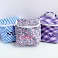 Perfect for lunch, beverages and bottles! Our cute Take Away insulted bag comes in a handy size with a 2 way, heavy duty zip, inside mesh pocket and top loop handle for grab and go! style. Signature wipeable coated cotton outside and lined in wipeable sheeting inside. Available in Garden Floral, as well as Royal, Sky, Pink, and Lavender Ginghams Size: 8"w x 3"d x 10"h Care: Wipe gently with a soft cloth Price includes standard monogram or font. *These are not stocked. Please contact about orderi Lunch Beverages, Floral Meadow, Sky Pink, Pink And Lavender, Insulated Bag, 2 Way, Diaper Bag, Gingham, 3 D