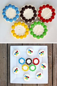 three different types of cupcakes on a white plate and one is decorated with the olympic rings