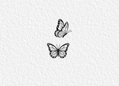 two butterflies flying next to each other on a white paper background with the number three