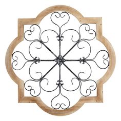 a wooden and metal clock on a white background