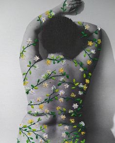 a woman with flowers painted on her body