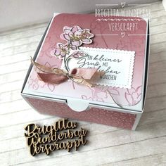 an open box with some flowers on it